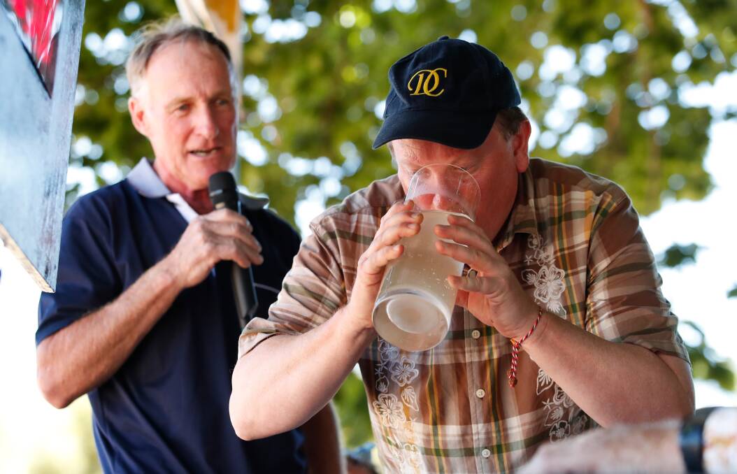 ACTION: Steven Darroch competes in the men's mineral water drinking competition under close watch in the 2019 Glenlyon Mixed Sports Day. Picture: Adam Trafford
