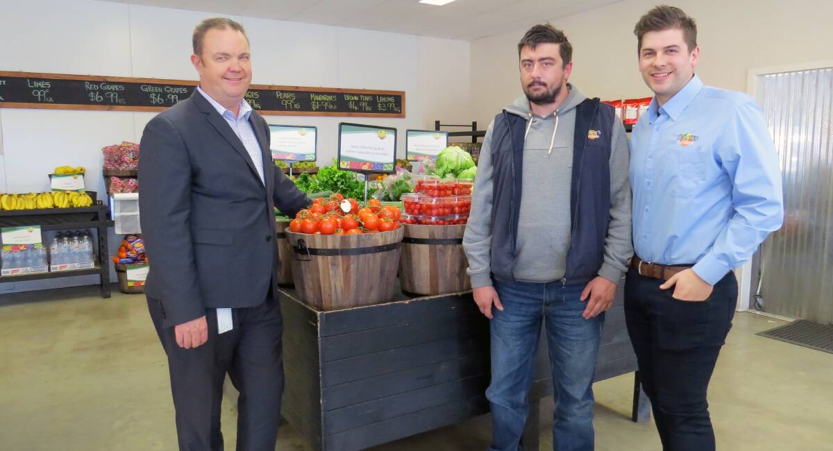 LEFT TO RIGHT: Travis Preston, Joshua Polson and Stewart Lawrence at Peaches Fruit Market. Joshua has been working at Peaches for nine months and has fortnightly contact with his DES consultant. 