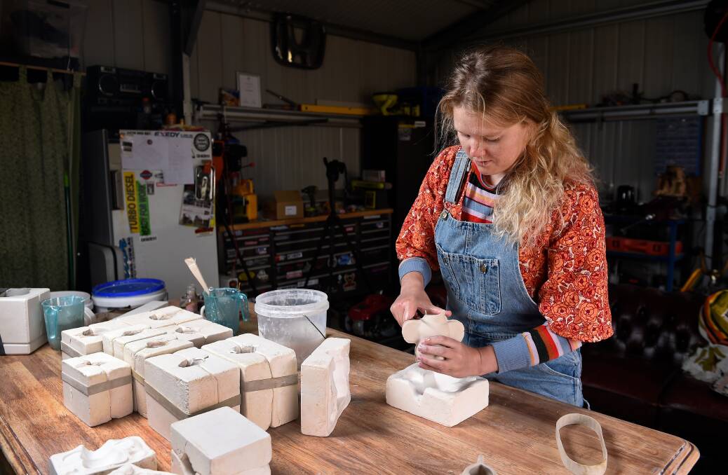 LOVE OF THE CRAFT: Shelby Sherritt creating her ceramic pots (above and below). Photos: Adam Trafford. 