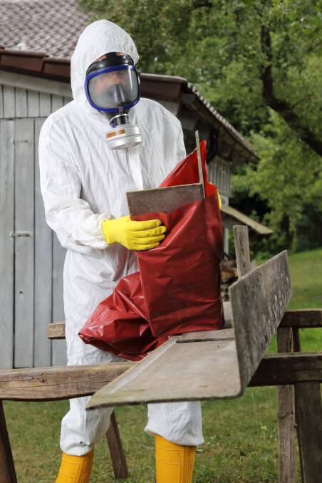 HANDLE WITH CARE: Don't take chances when handling deadly asbestos.
