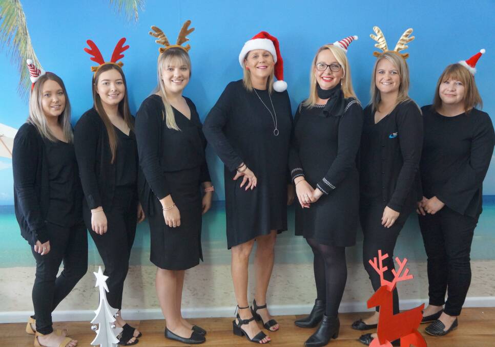 FESTIVE CHEER: Kylee and the staff at Frank Ford Travel would like to wish all existing and new clients a very happy Christmas, and a new year full of new horizons.

