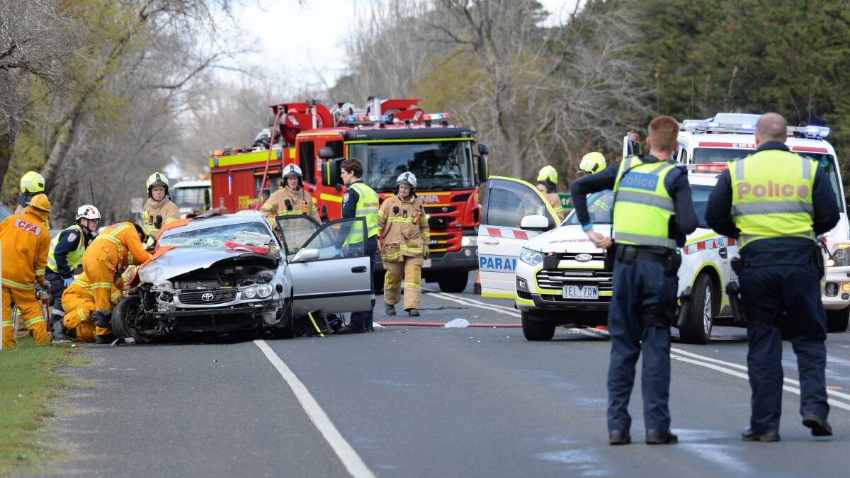 Emergency services work to free a woman at an accident on Remembrance Drive last week. Picture: Kate Healy