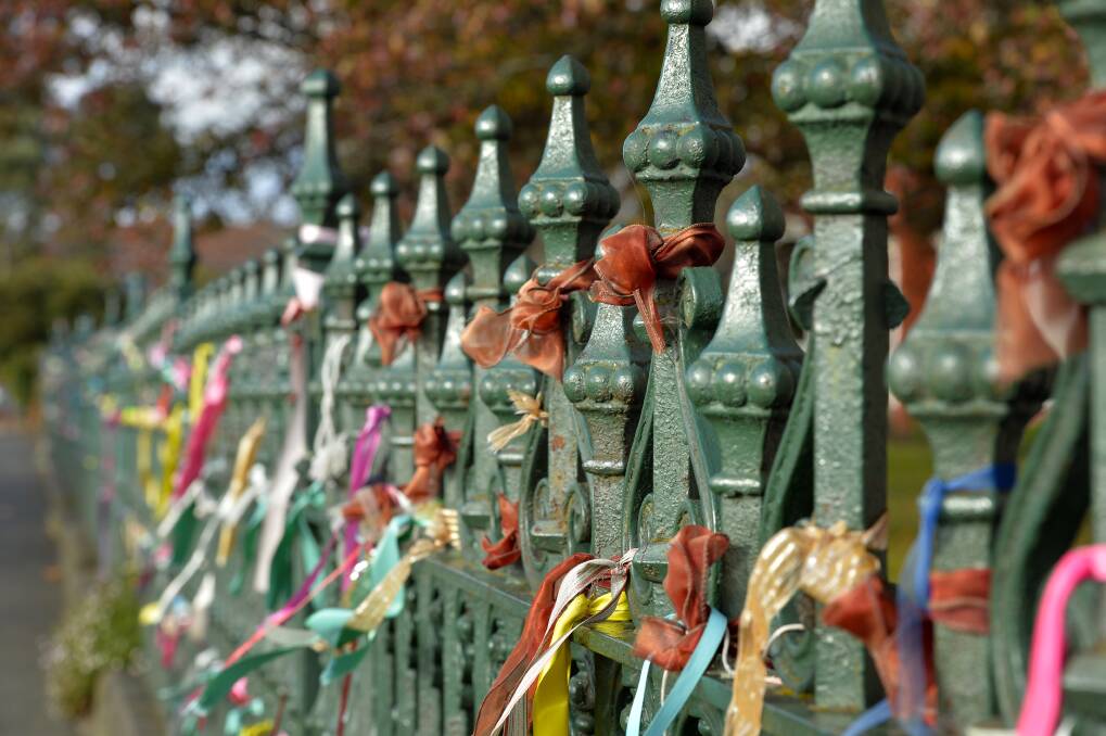 Reminders: Ribbons on the St Alipius fence. File photo