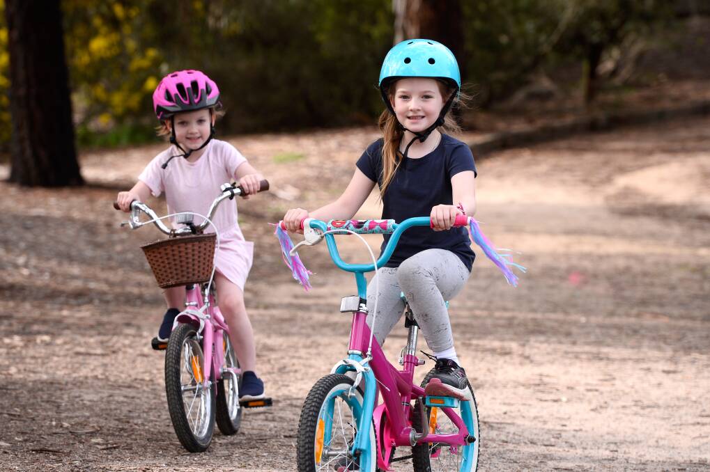 Silvie and Sybella ride their bikes at Lake Esmond. Picture: Adam Trafford