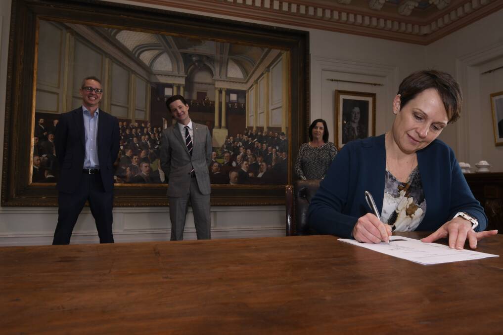 Jaala Pulford signs the charter at Town Hall. Picture: Lachlan Bence
