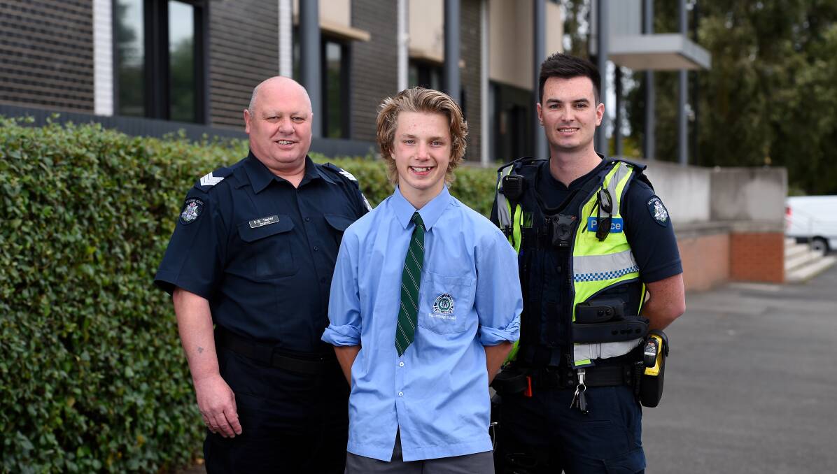 Nomination: Sergeant Chris Taylor and Constable Jack Johnstone with 15-year-old Riley Seccull. Picture: Adam Trafford