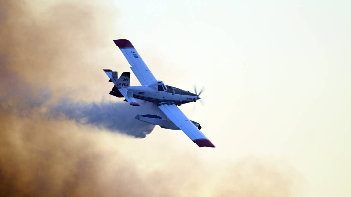 A waterbomber hits the fire in Dereel. Picture by Kate Healy