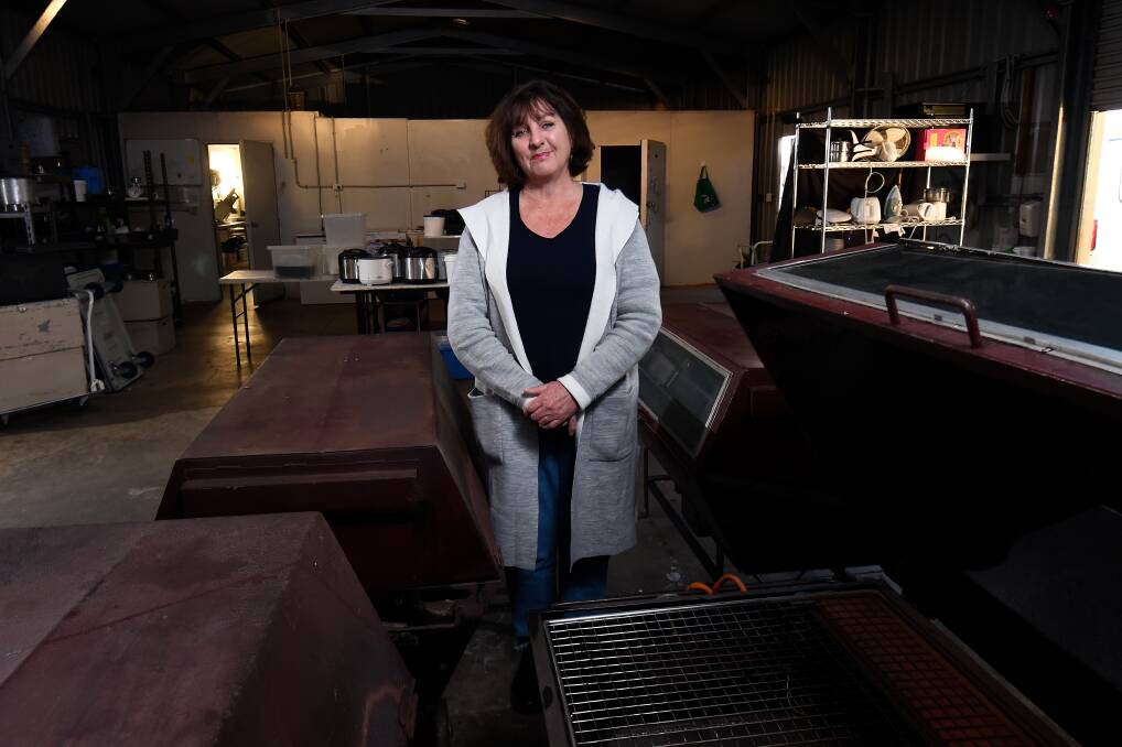 Goodbye: Fabulous Feast's Elizabeth Smith in her shed with the last of her catering gear. Picture: Adam Trafford
