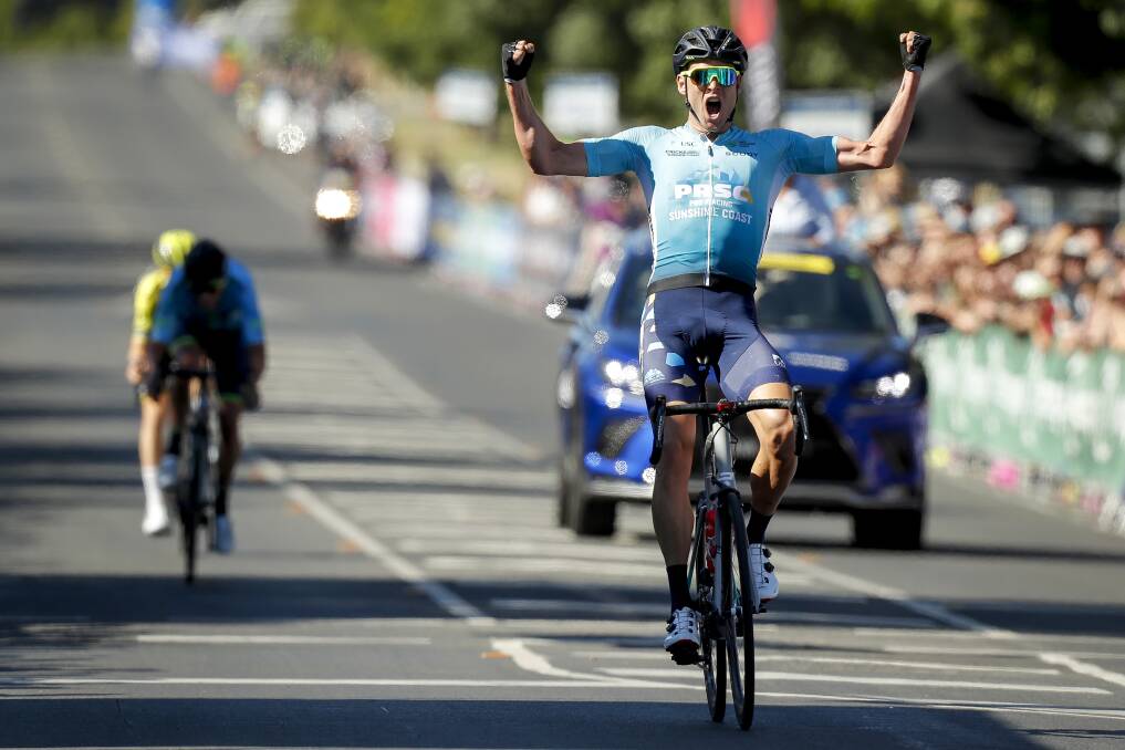 Michael Freiberg celebrates a win as he crosses the finish line during the Elite Men's Road Race. Picture: Dylan Burns