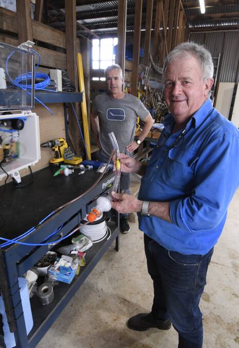 Gekko's Sandy Gray in his shed with an early prototype in April with Committee for Ballarat chief executive Michael Poulton. Picture: Lachlan Bence