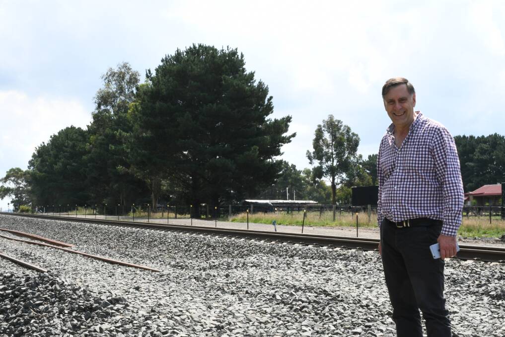 End of the line: Nick Beale points out the track stops just before the Geelong-Ballan Road crossing.