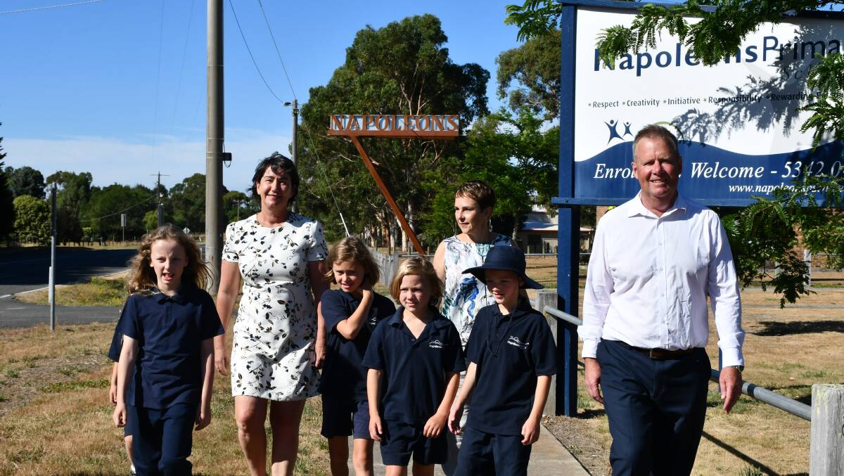 Buninyong MP Michaela Settle, Roads Minister Jaala Pulford, and Napoleons Primary School principal Trevor Edwards walk to school with grade one students.