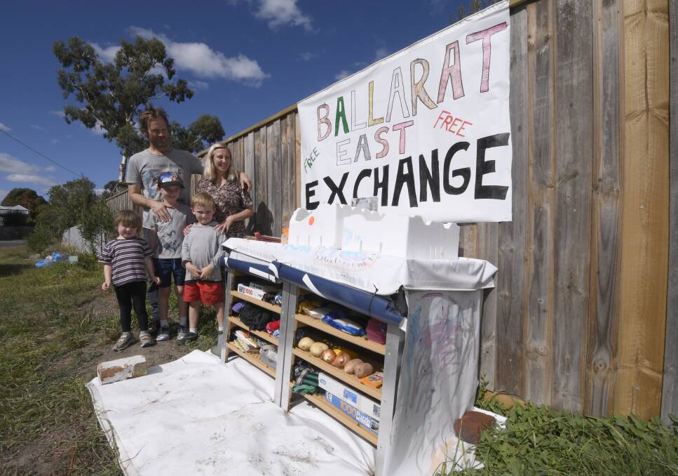 It's free: Tammy Marriott with Paul and their kids Howard, Ryan, and Selan in front of the Specimen Vale South exchange. Picture: Lachlan Bence