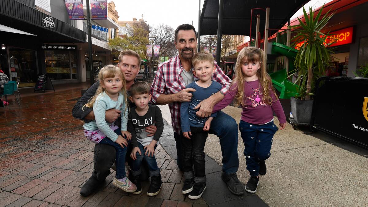 Open space: Chris Angel and Mike Kontor with Izzy, Logan, Melanie and Jake in Bridge Mall. Picture: Adam Trafford
