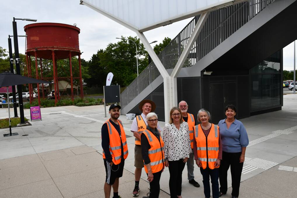 Helping out: Ballan's Stationeers pose with state Transport Infrastructure Minister Jacinta Allan and Buninyong MP Michaela Settle in front of buildings old and new. Picture: The Courier