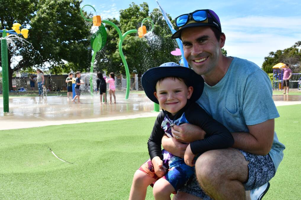 Cooling off: Eamonn Nolan with four-year-old Hamish. Pictures: The Courier