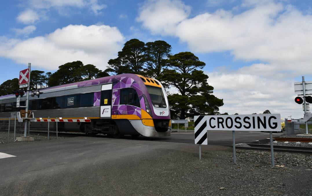 A V/Line train at a level crossing in Ballan. Picture: The Courier