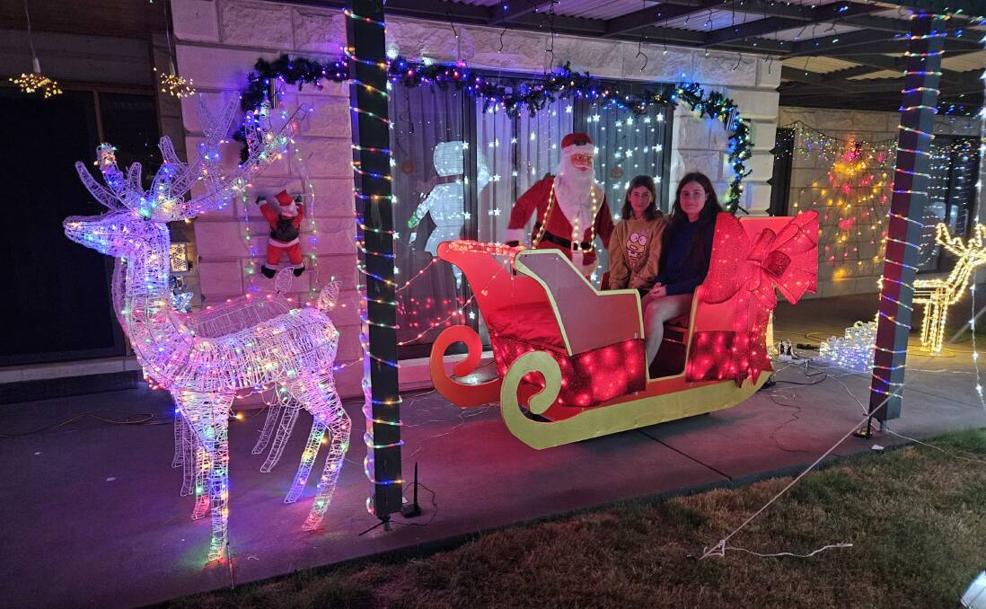 Santa is up for photos at the Christmas light display at 1 Diamond Drive in Cardigan most nights. Picture contributed