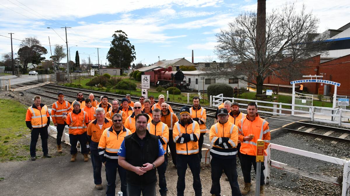 Solidarity: Workers outside the Ballarat Alstom facility with Ballarat Regional Trades and Labour Council secretary Brett Edgington.