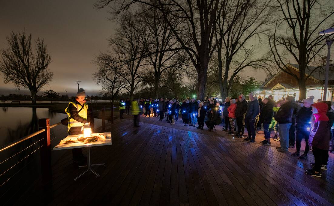 At the 2019 Out of the Shadows Walk, Lifeline Ballarat manager and Ballarat and District Suicide Prevention Network deputy chair Michelle MacGillivray lights a candle to remember the lives lost to suicide. Pictures: Peter Kervarec