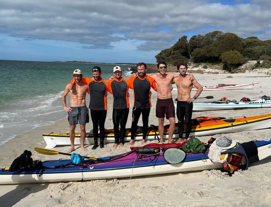 Paddling out: The Strait Yakers take a break before heading back out on their trip to Tasmania. Picture: contributed