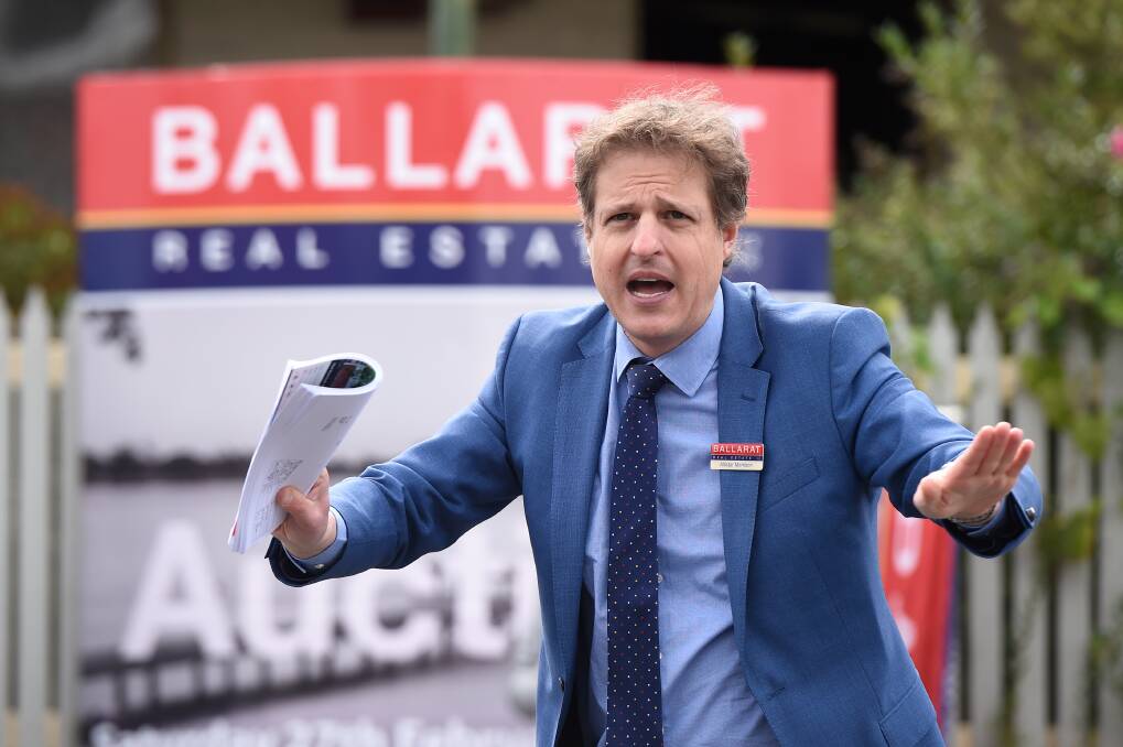 Sold: Auctioneer Allister Morrison sells the East Street South property. Picture: Adam Trafford