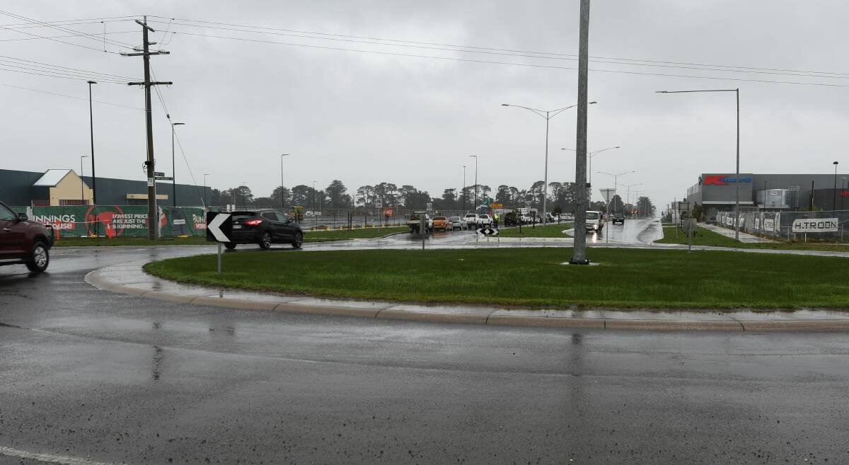 A rainy afternoon in Delacombe - this roundabout, connecting the Glenelg Highway to Wiltshire Lane and Cherry Flat Road, will become a set of traffic lights. Picture: Lachlan Bence