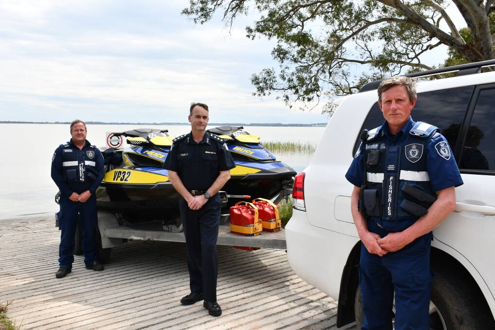 DELWP officers Ash Burns and Steve Eddy with Inspector Greg Barras (centre) at Lake Burrumbeet on Friday.