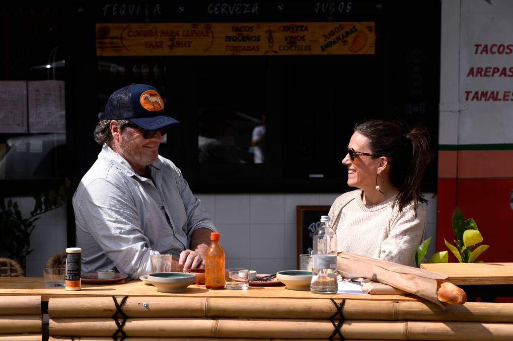 Paulie D and Amy Harrington from Bendigo enjoying some lunch while sitting outdoors at Pancho. Picture: Adam Trafford