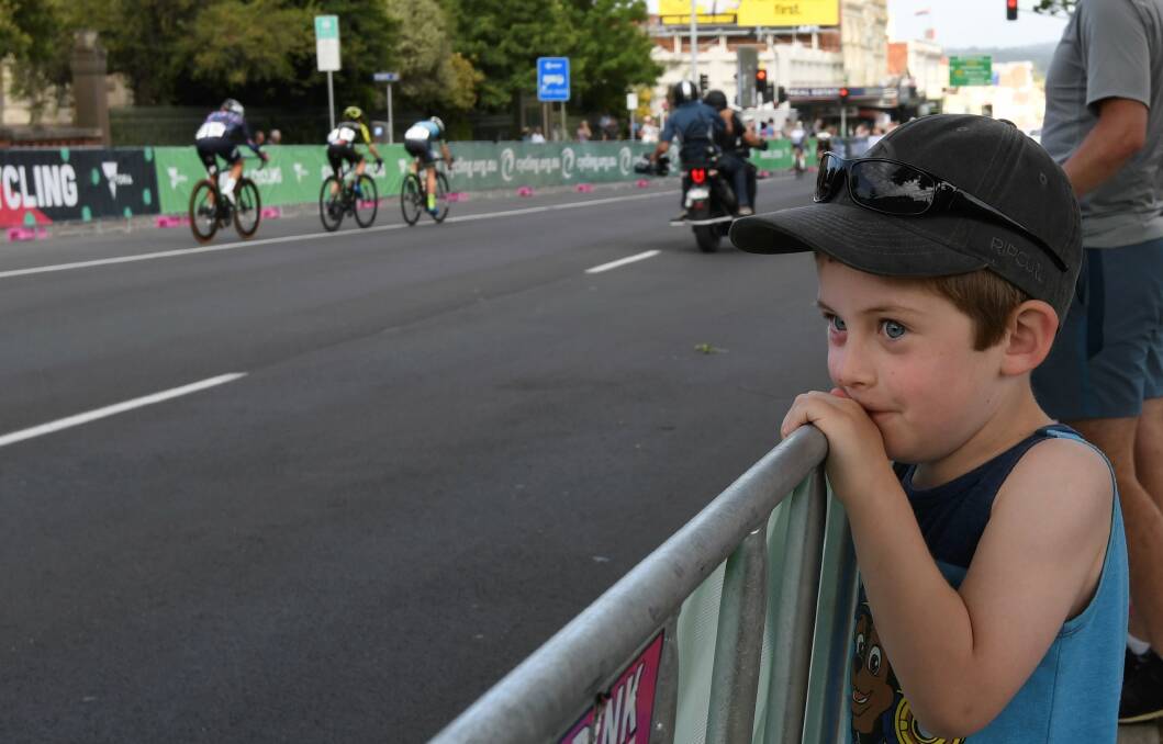 Big fan: Harry Lewis watches the race from the sidelines. Picture: Lachlan Bence