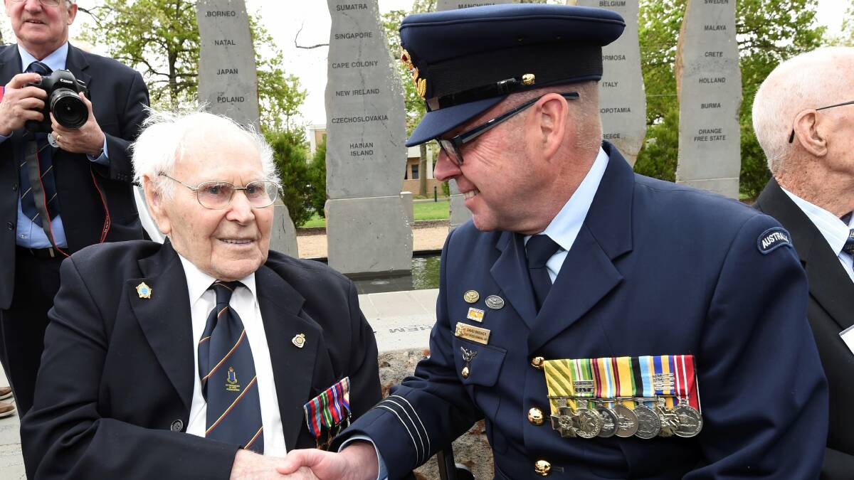 100-year-old Eric Johnston and RAAF Staff Officer David Brewer. Picture: Lachlan Bence