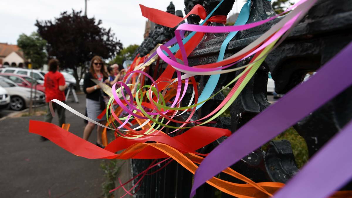 Ribbons tied to the fence of St Patrick's Cathedral, the Diocese of Ballarat headquarters, recognising children abused by clergy. Photo: Lachlan Bence