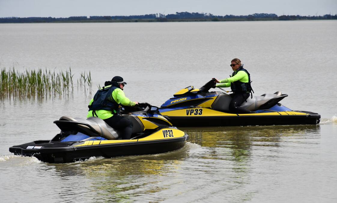 Victoria Police water officers prepare for a patrol at Lake Burrumbeet.