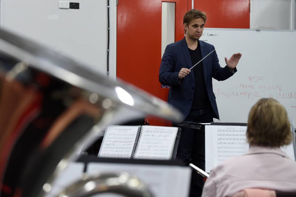 Dr Mario Dobernig conducts the Ballarat Wind Orchestra rehearsal. Pictures: Kate Healy