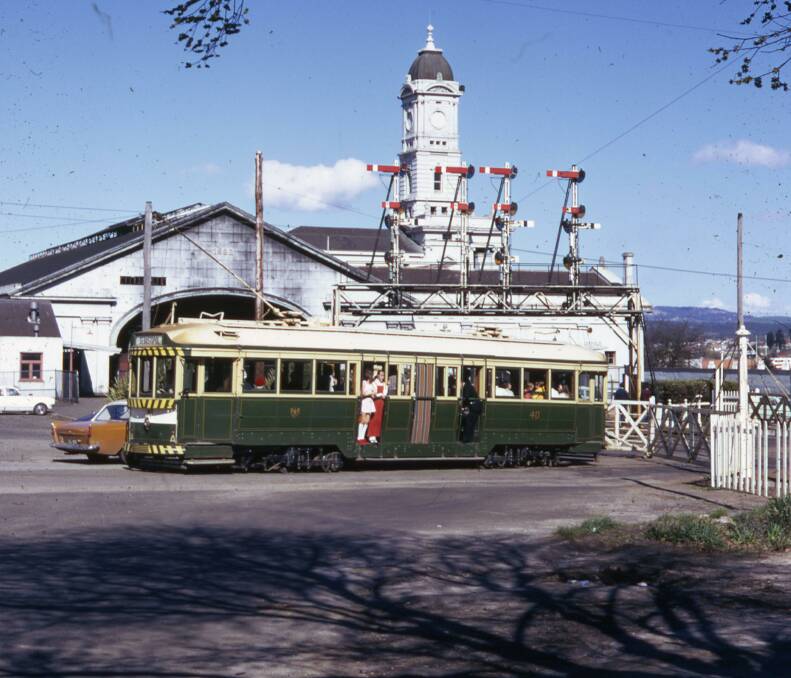 Another time: A tram waits for the swing gates to open. Picture: Campbell Duncan