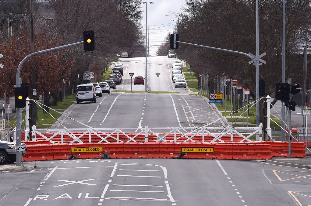 Looking north past a closed Lydiard Street crossing. Picture: Adam Trafford