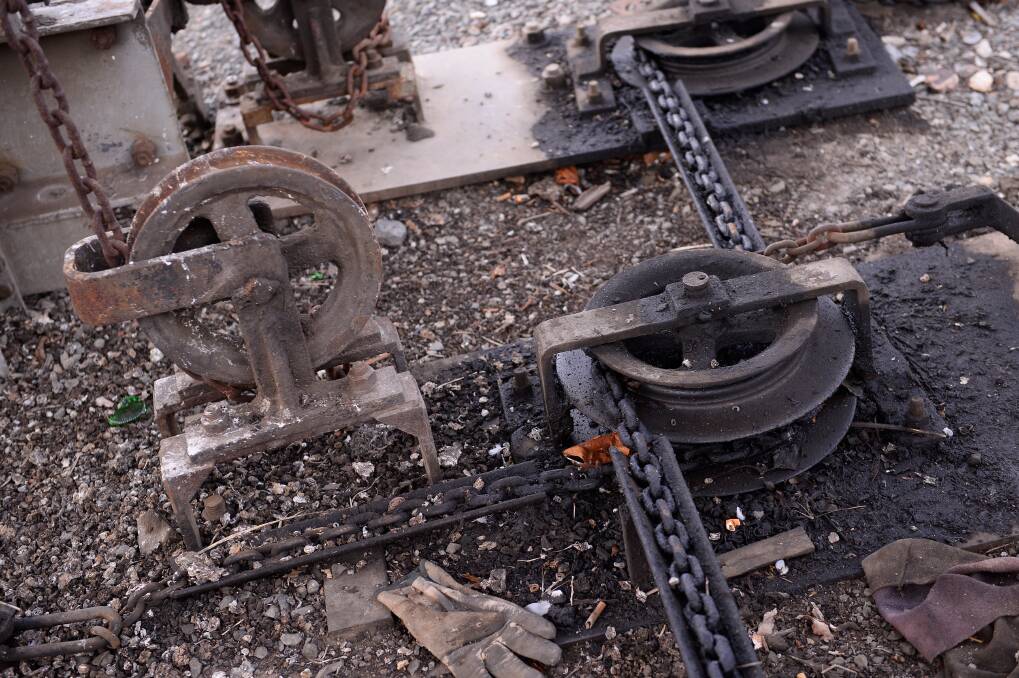 The mechanisms used to open the gates underneath the signal box. Picture: Adam Trafford