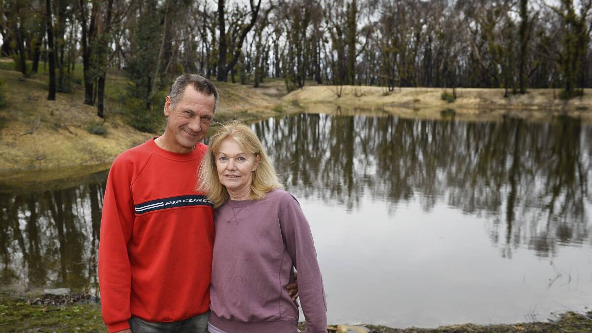 Moving on: Trevor and Donna Hart on their property in 2016, a year after the fire. Picture: Dylan Burns