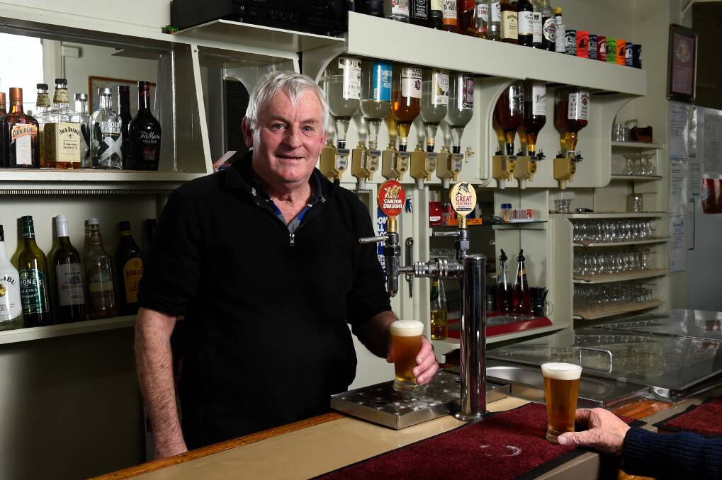 Last drinks: Millers Arms publican Darryl Stewart pours a seven behind the bar. Pictures: Adam Trafford