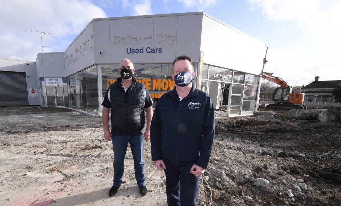 Matt Haymes, with Jamie Wilson, Haymes' retail and trade state manager, at the new site as demolition works get under way. Picture: Lachlan Bence