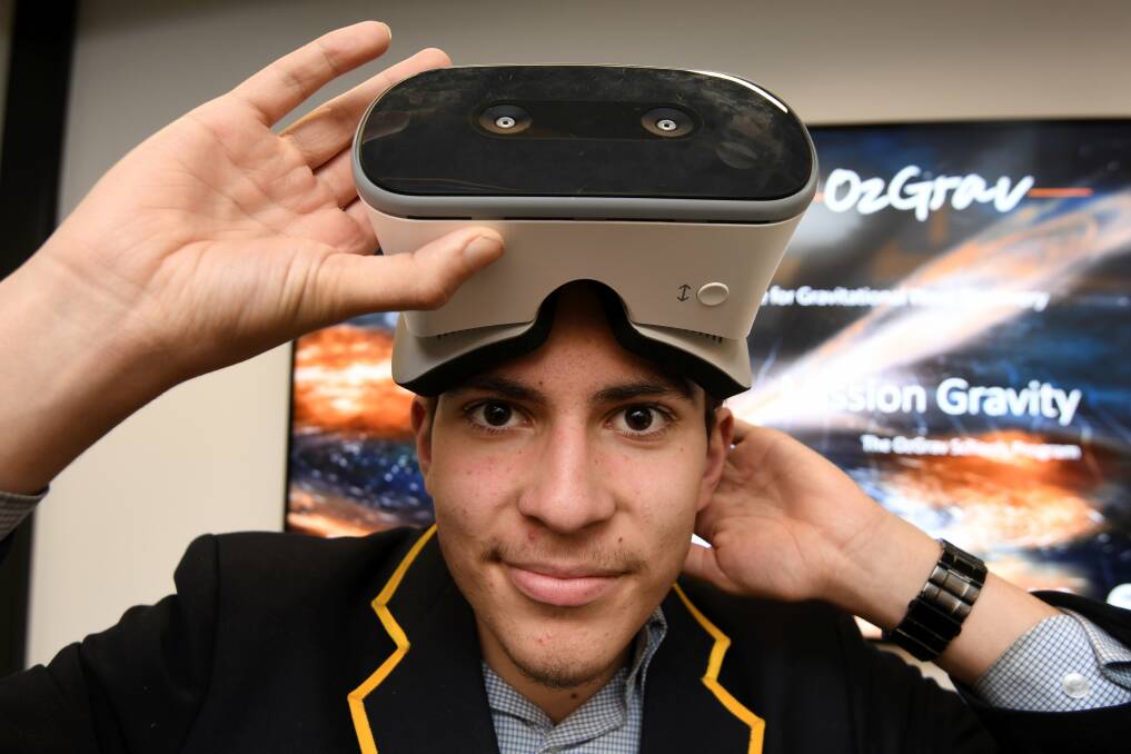 Visionary: Sean, a year 10 from Mount Rowan Secondary College, checks out OzGrav's Mission Gravity headset. Picture: Lachlan Bence