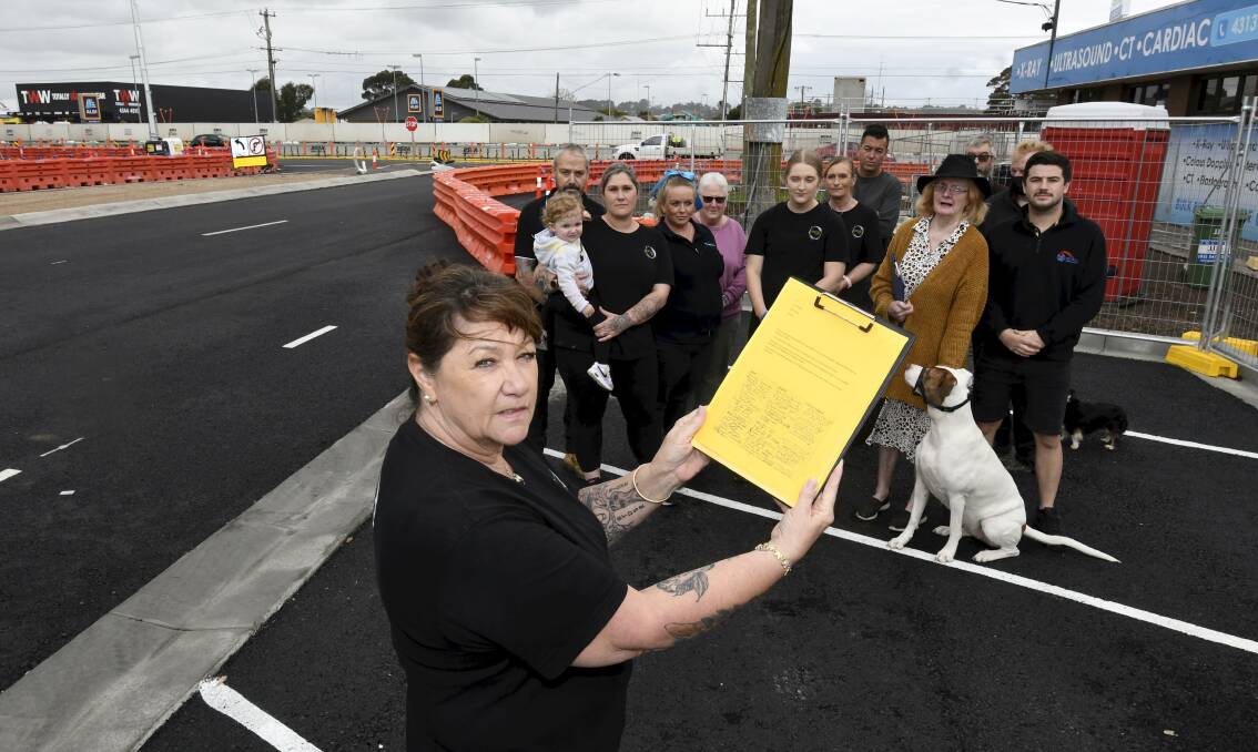 Curbside Cafe's Tracey Nunn with business owners and residents on Hertford Street. Picture: Lachlan Bence
