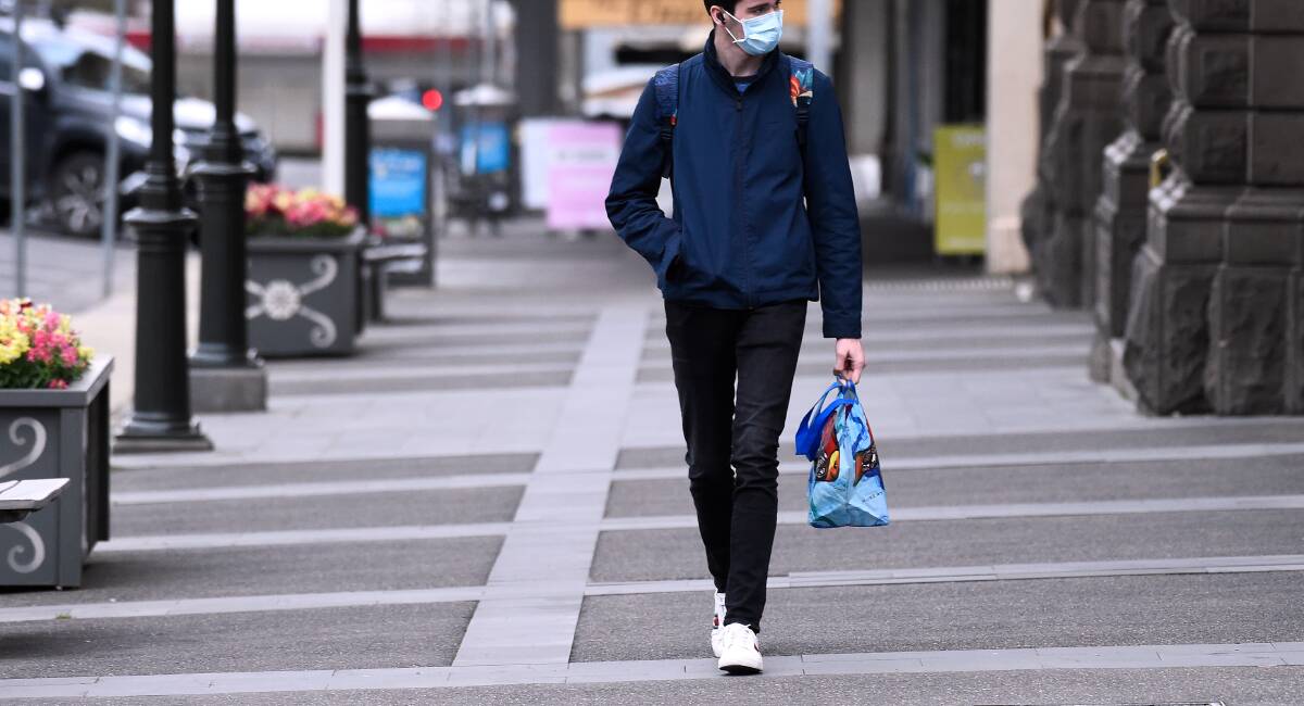 A man walks down Sturt Street wearing a mask. Picture: Adam Trafford