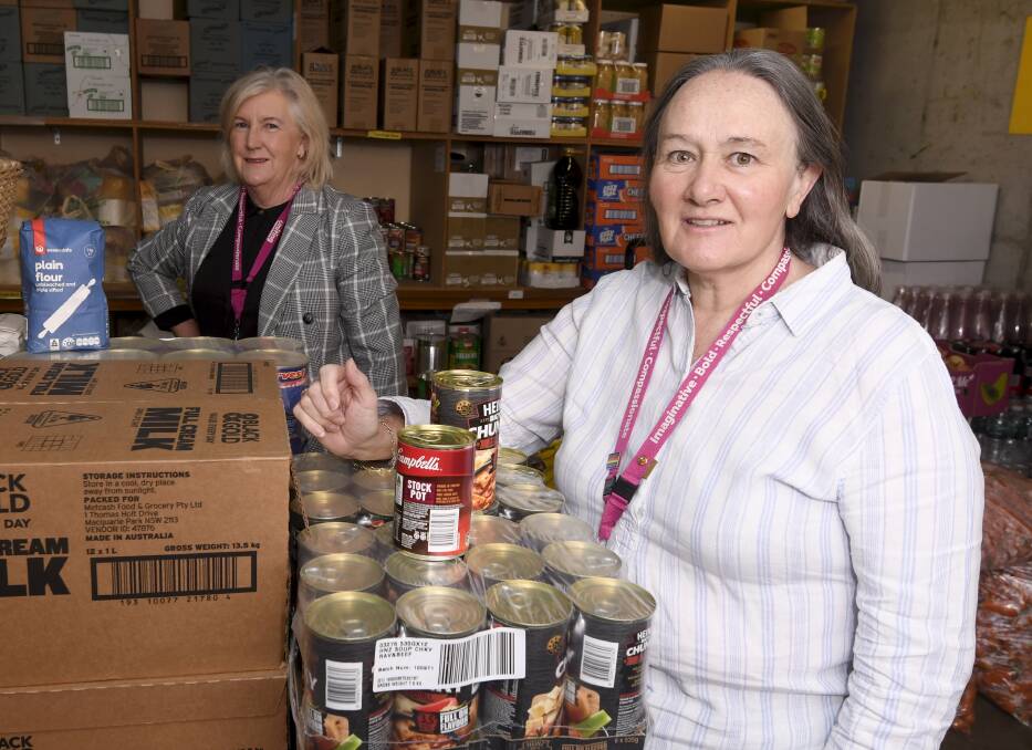 Help is on its way: Uniting Ballarat's Jennifer Wright and Annette Kelly-Egerton in the pantry at Ballarat's Breezeway, which helps feed anyone that needs a meal. Picture: Lachlan Bence