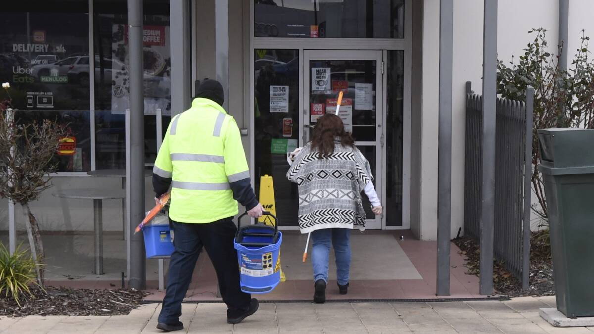 Cleaners arrive at the Wendouree Hungry Jack's last Tuesday. Picture: Lachlan Bence