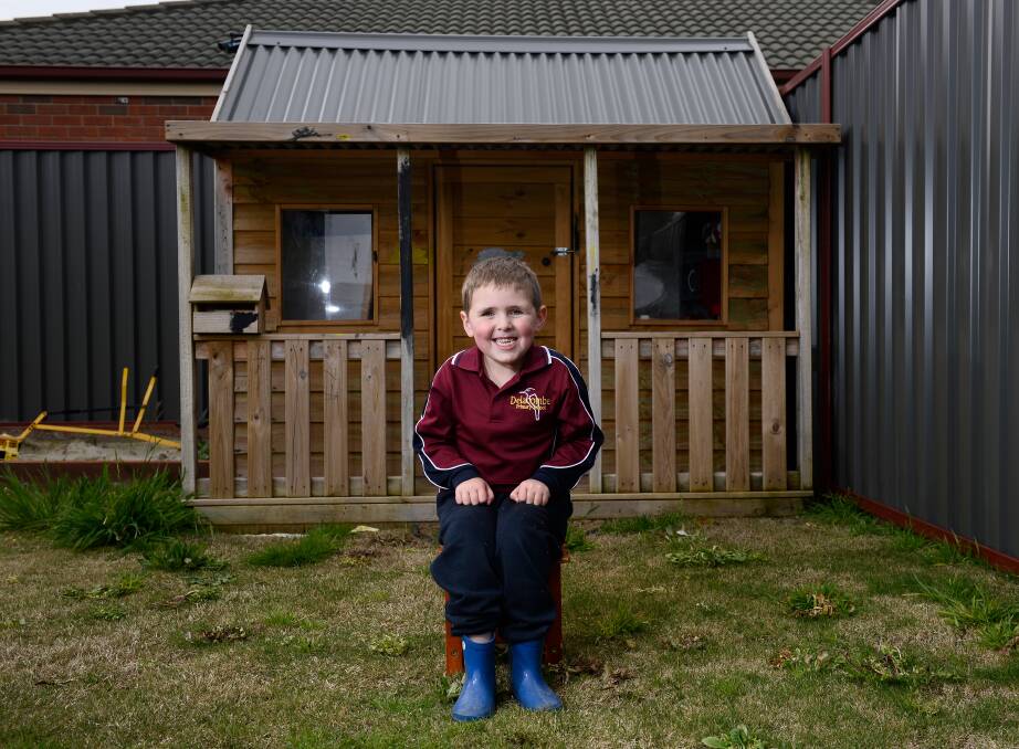 CHEESE: Ollie Powell is in prep but his family won't have the usual school portrait to remind them of his first year of school. Picture: Adam Trafford