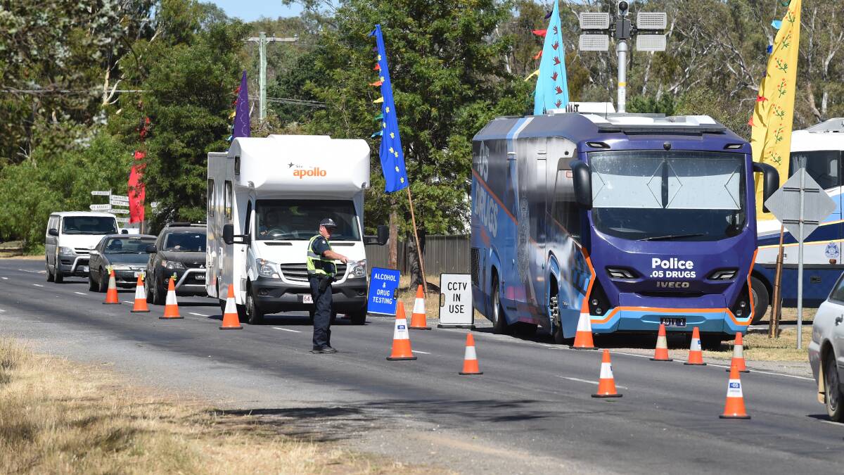 Police directing traffic through a breath test site at Lexton this year. Picture: Kate Healy