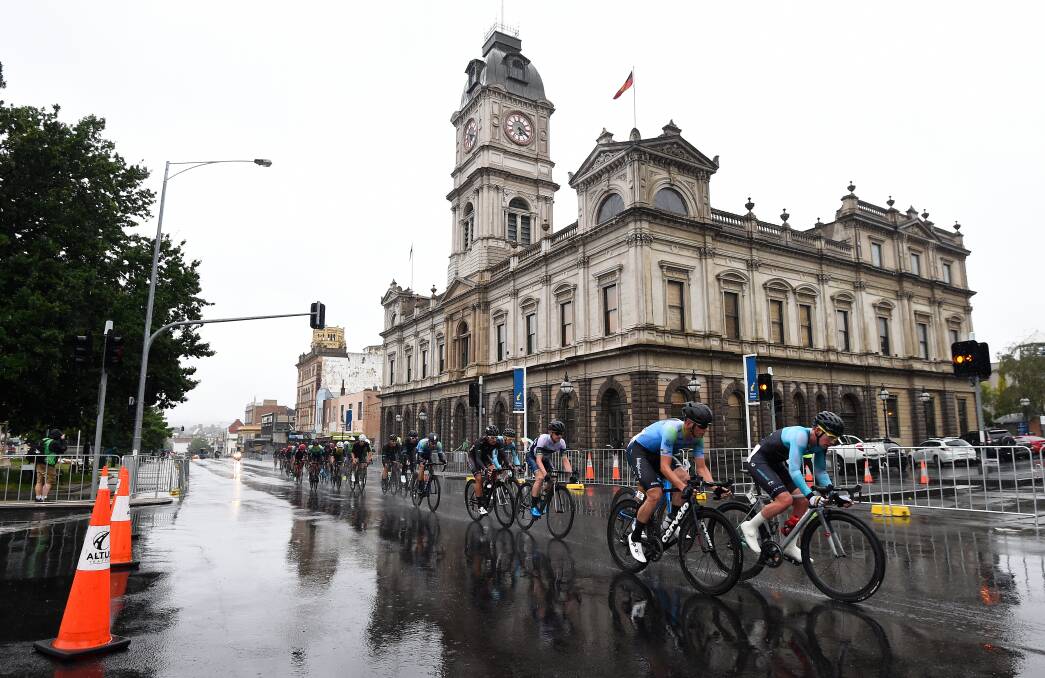 Sprint: Riders in last year's elite men's criterium power through the rain up the hill past Town Hall. Picture: Adam Trafford