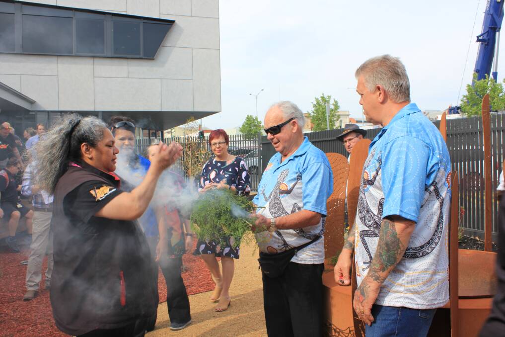 Tradition: A smoking ceremony is held as part of the official opening of BADAC's new medical centre. Picture: Ashleigh McMillan
