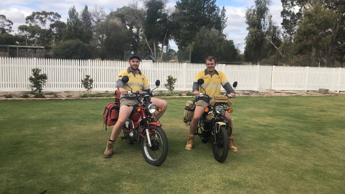 On the road: Tyler McRae and Tyler Dittloff on their postie bikes before they set off on their journey to Cairns. Picture: contributed
